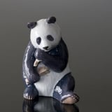 Panda eating bamboo looking content, Royal Copenhagen figurine no. 662