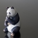 Panda eating bamboo looking content, Royal Copenhagen figurine no. 662