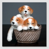 Puppies in a basket looking sweet, Royal Copenhagen dog figurine