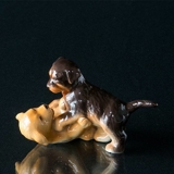 Golden Retriever and rottweiler puppies playing, Royal Copenhagen dog figurine