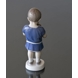 Boy holding a dog in front of him, Ole. Bing & Grondahl figurine no. 1747 or 422