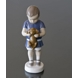 Boy holding a dog in front of him, Ole. Bing & Grondahl figurine no. 1747 or 422