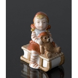 Pixie on Sleigh with a teddy bear, Royal Copenhagen Christmas figurine