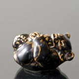 Bear Cub lying down bitting its foot, Royal Copenhagen stoneware figurine no. 21434