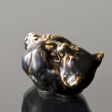 Bear Cub lying down bitting its foot, Royal Copenhagen stoneware figurine no. 21434