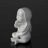Baby sitting with his blanket on his head, white Royal Copenhagen figurine