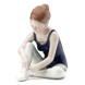 Ballerina sitting tying her shoes, Royal Copenhagen figurine no. 134
