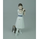 Ballerina standing doing her hair, Royal Copenhagen figurine no. 138