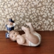 Pludrende baby liggende på ryggen, Royal Copenhagen figur nr. 244