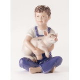 Boy with piglet, Royal Copenhagen figurine