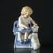 Girl feeding dog, Royal Copenhagen figurine no. 451