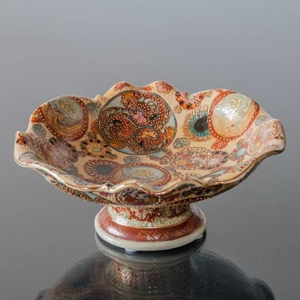 Chinese bowl with colourful pattern, on foot with wave edge.