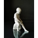 Dreng siddende på sten, Royal Copenhagen figur nr. 520