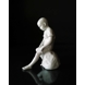 Dreng siddende på sten, Royal Copenhagen figur nr. 520