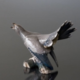 Cuckoo sitting on branch screeching, Bing & Grondahl bird figurine no. 1020423 / 1770