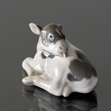 Calf lying down licking its back, Bing & Grondahl figurine