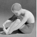 Boy taking off sock, Bing & Grondahl figurine no. 2199