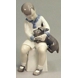 Boy sitting with Dog, Bing & Grondahl figurine No. 2201
