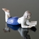 Merete, Girl lying and reading her book, Bing & Grondahl figurine no. 2304
