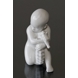 Child with sea horse holding it lovingly, Bing & Grondahl figurine no. 2396