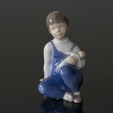 Girl sitting with Doll on her arm, Bing & Grondahl figurine