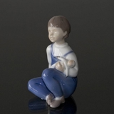 Girl sitting with Doll on her arm, Bing & Grondahl figurine