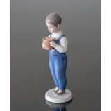 Boy standing with bucket, Joergen, Bing & Grondahl figurine