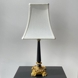 Vintage table lamp in black wood and brass.
