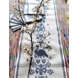 Embroidered table runner and placemats with blue pattern
