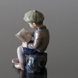 Boy, sitting reading, figurine Dahl Jensen