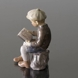 Boy sitting reading figurine Dahl Jensen, brown colours No. 1096