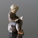 Boy sitting reading figurine Dahl Jensen, brown colours No. 1096