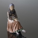 Woman sitting in National Costume figurine Dahl Jensen No. 1110