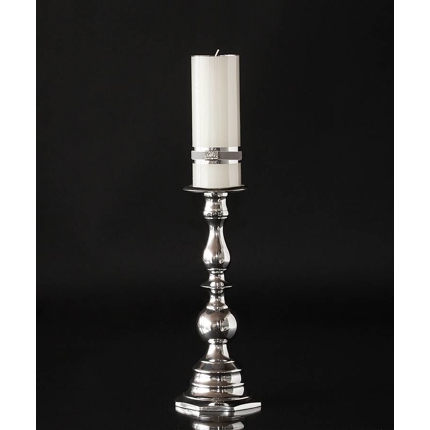 Candlestick in aluminium with round shapes.