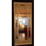 Faceted mirror with golden decoration