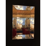 Faceted mirror with frame