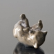 Brown bear lying down playing with its Foot, Royal Copenhagen figurine No. 1124