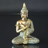 Buddha sitting with arms crossed in contemplation, gold color polyresin