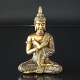 Buddha sitting in contemplation with arms crossed, gold color polyresin