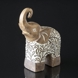 Elephant with trunk held high, beige polyresin