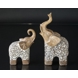 Elephant with trunk held high up, beige polyresin